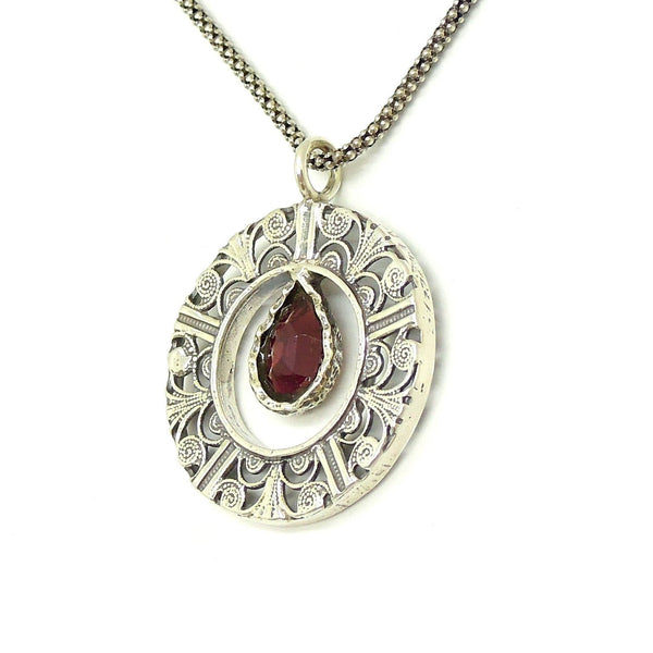 Pendant - Drop Shaped Garnet In A Round Filigree Silver Pendant